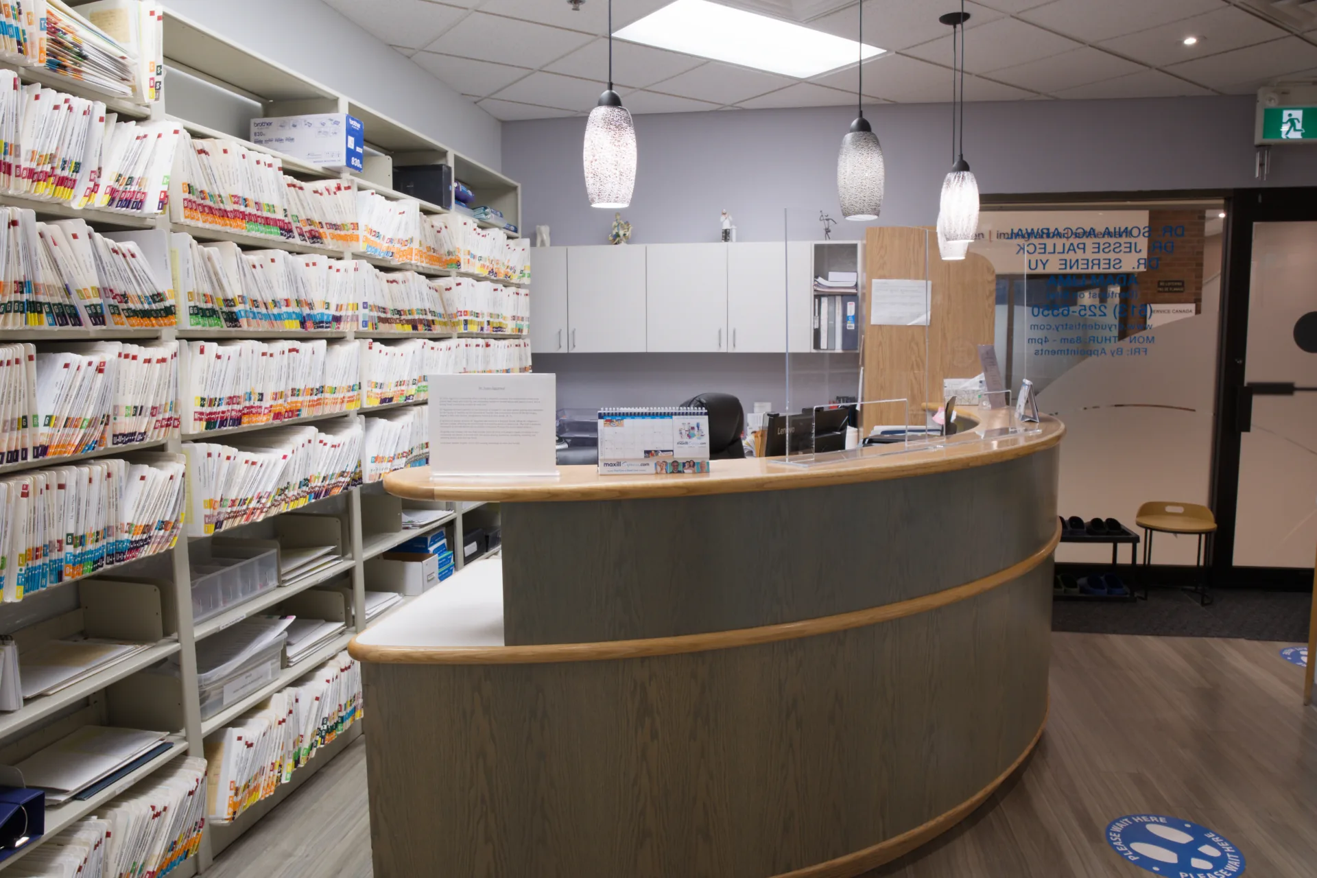 Front desk and records shelving viewed from inside the clinic