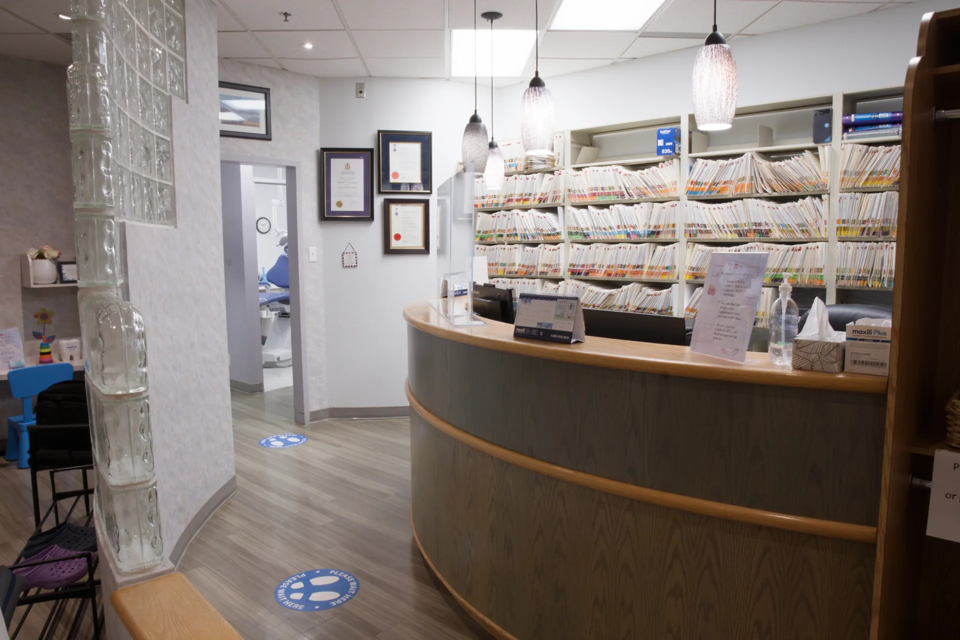 Reception counter and glass-block wall at Dr. Serene Yu Dentistry