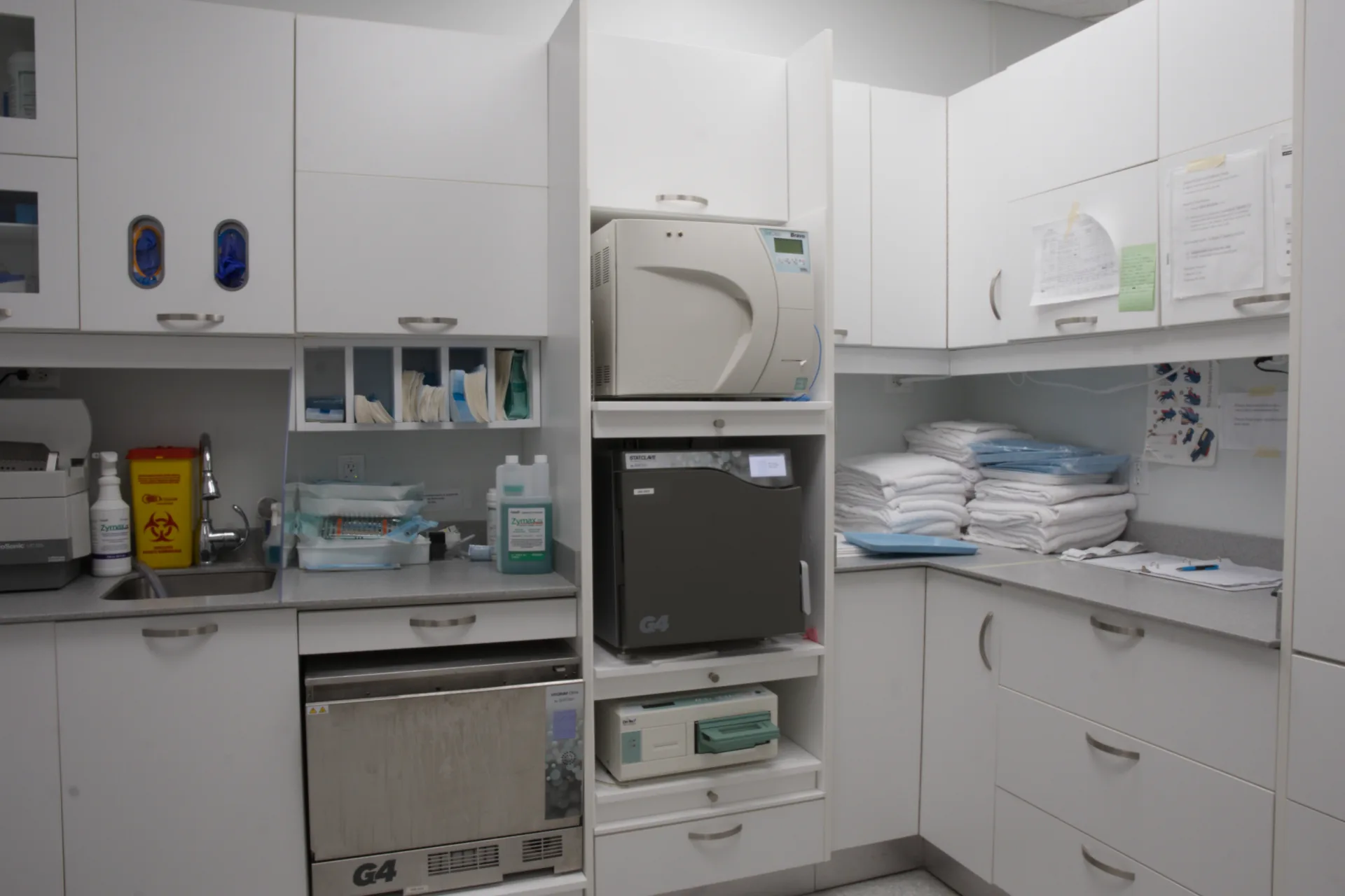 Sterilization room with instrument-processing equipment and storage cabinets
