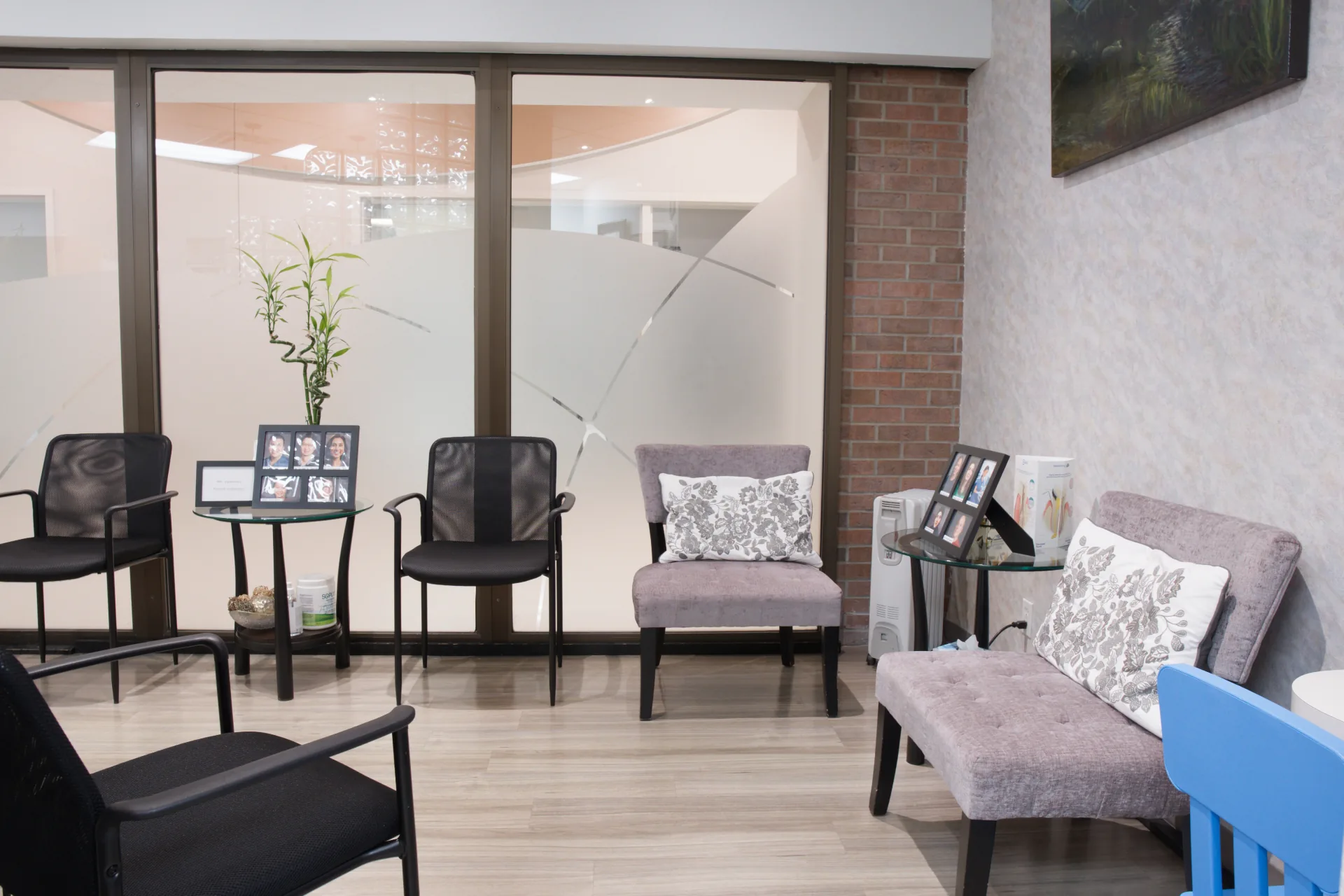 Clinic waiting area with armchairs, a sofa and children's seating