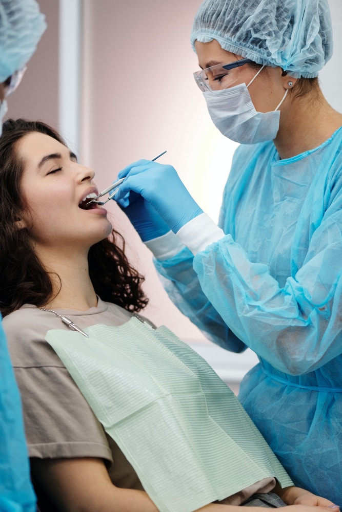 Dentist examining gums